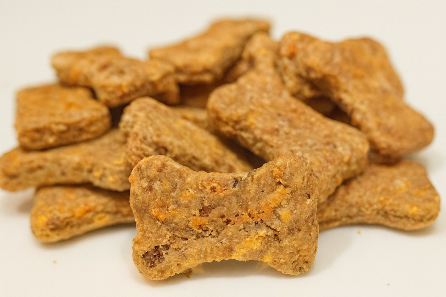 Bacon Cheddar Biscuits with Duvall Farms Bacon. Handmade organic dog treats from The Chosen Spot K9 Kitchen on a white background.