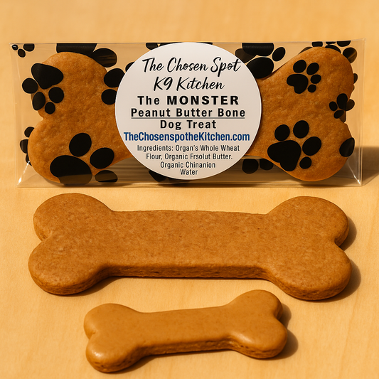 MONSTER Peanut Butter Bone from The Chosen Spot K9 Kitchen next to an average sized Peanut Butter Bone, label on a beige background.