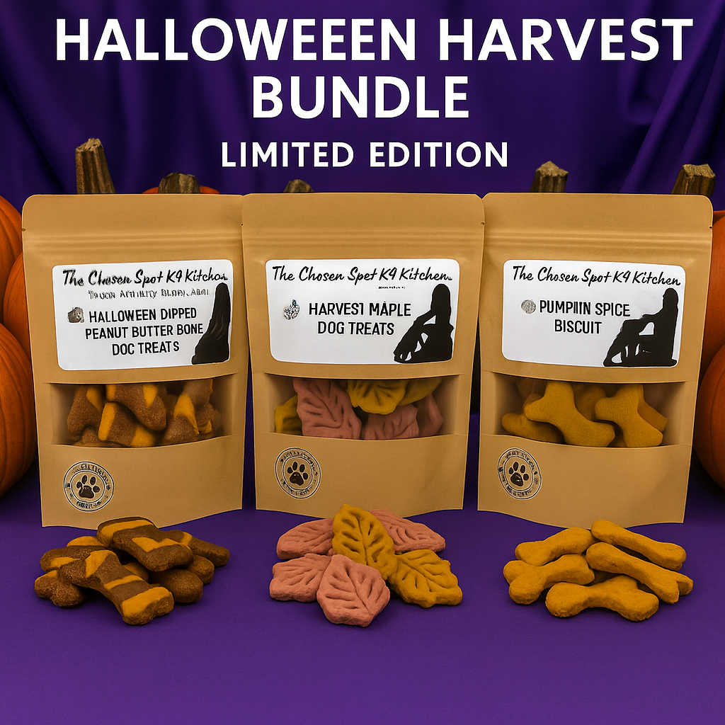 Three packages of 'The Chosen Spot K9 Kitchen's hanmade organic dog treats on a purple background with Halloween-themed treats displayed in front.
