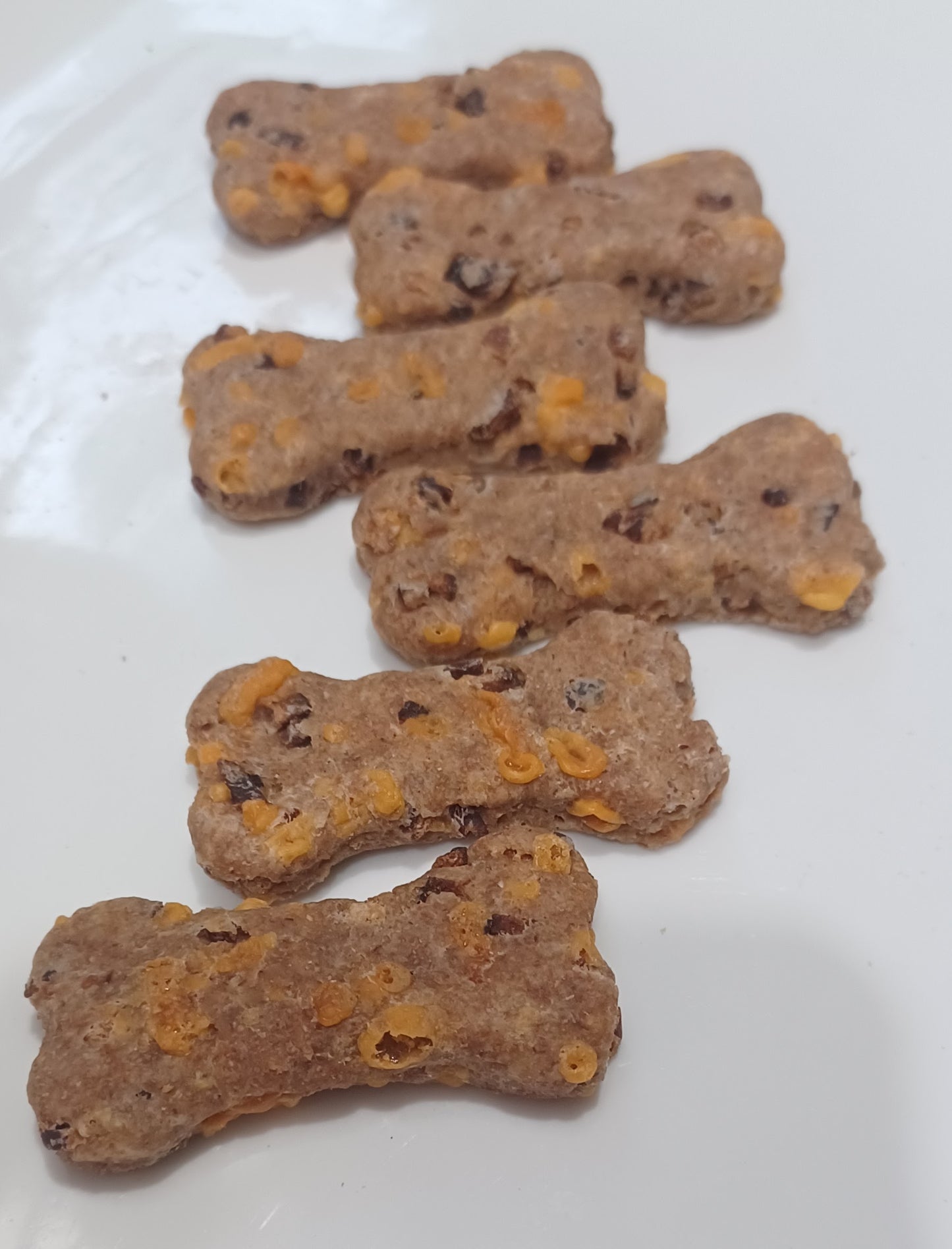 a row of bacon cheddar biscuits healthy organic dog treats lined up next to each other