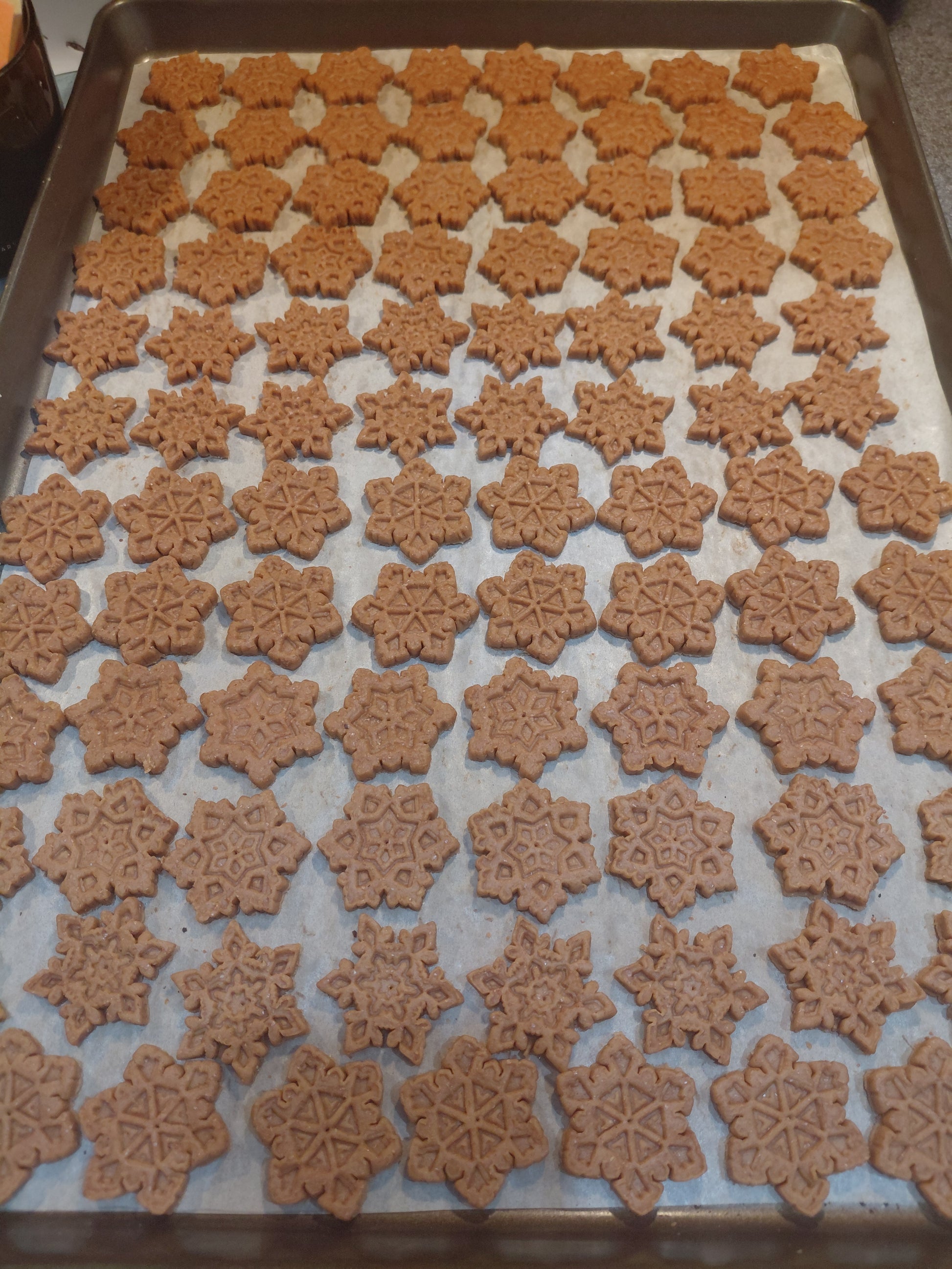 Baking tray with Peanut Butter Snowflakes, handmade organic dog treats from The Chosen Spot K9 Kitchen