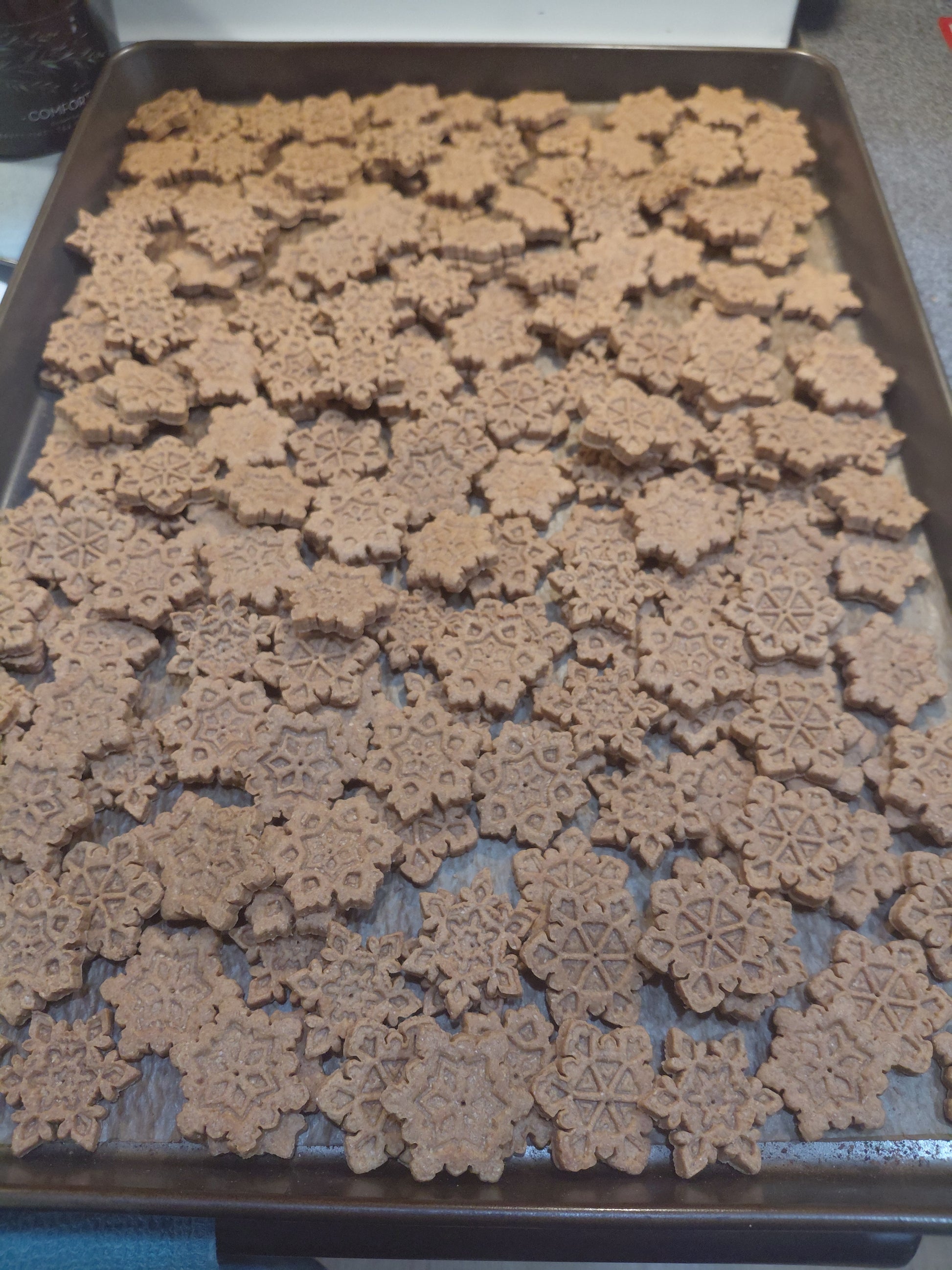 Baking tray with Peanut Butter Snowflakes, handmade organic dog treats from The Chosen Spot K9 Kitchen