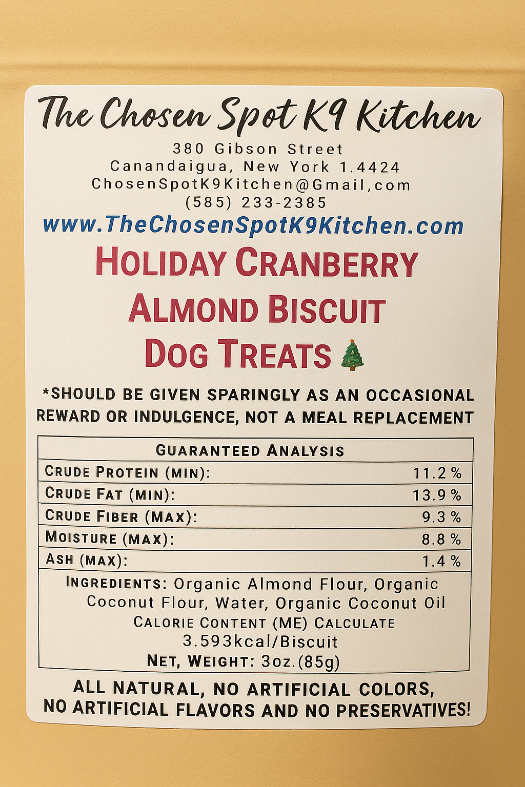 Holiday Cranberry Almond Biscuits. Handmade organic dog treats from The Chosen Spot K9 Kitchen. Bag back label showing, Guaranteed analysis, ingredient and calorie content (ME) calculated.