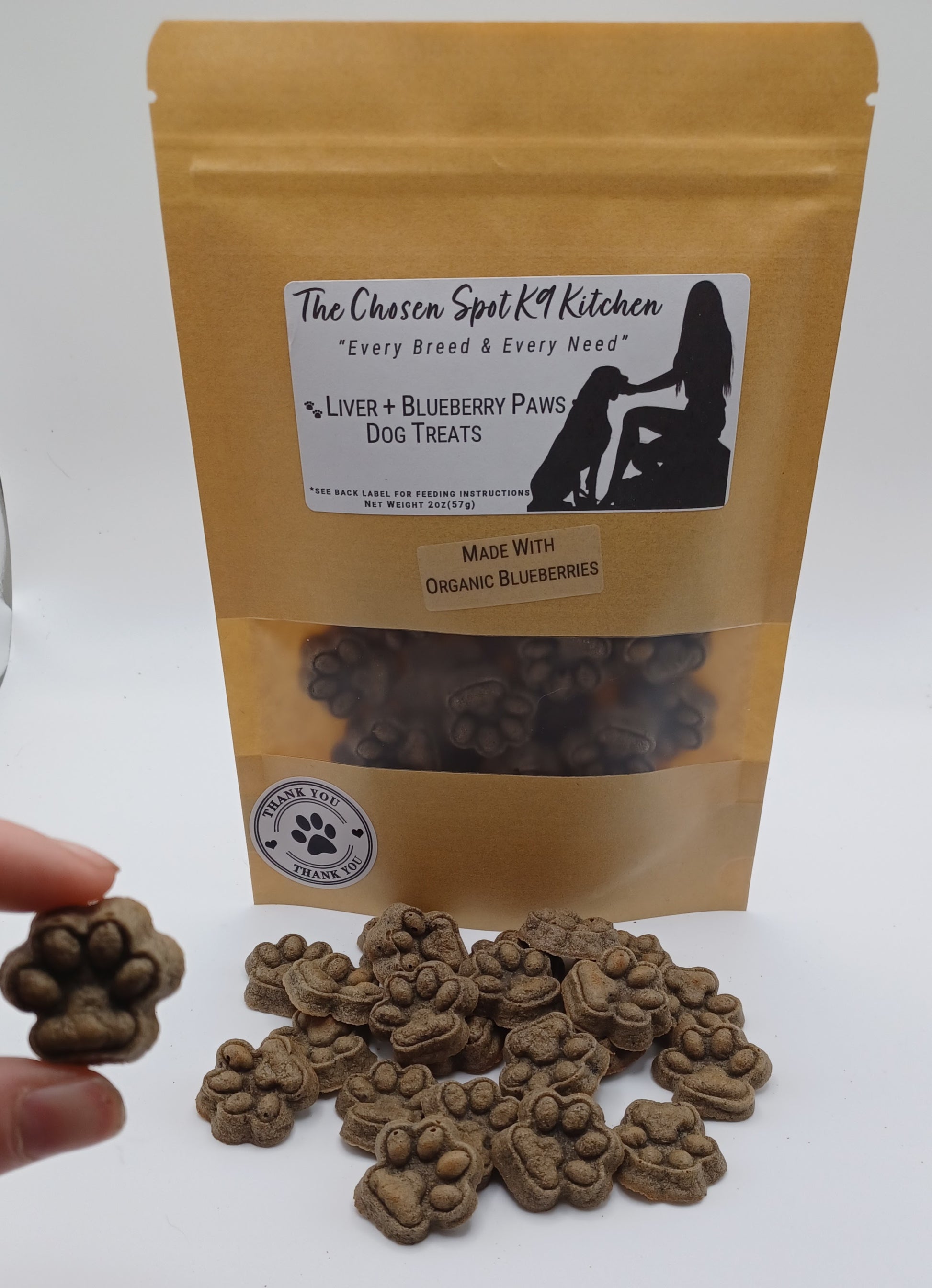 Dog treats with a branded packaging on a white background