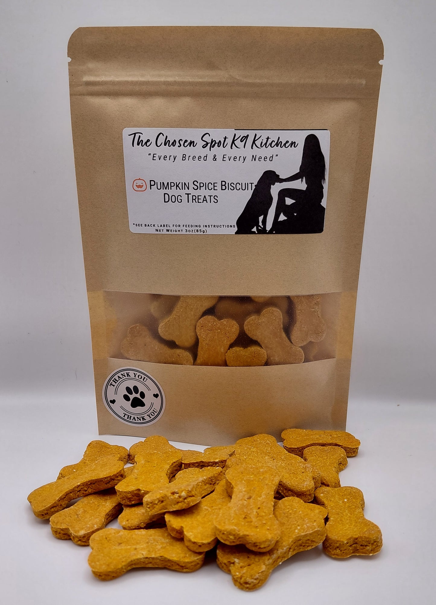 Pumpkin Spice Biscuit handmade organic dog treats in a brown paper bag from The Chosen Spot K9 Kitchen
